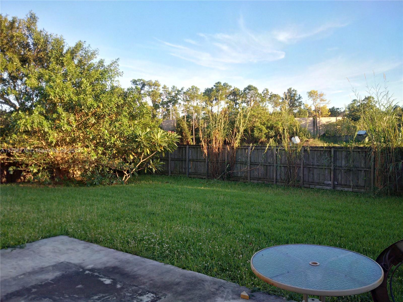 13060 Southwest 263rd Terrace Homestead, FL 33032 - Photo 23 of 28 a view of a backyard with green space