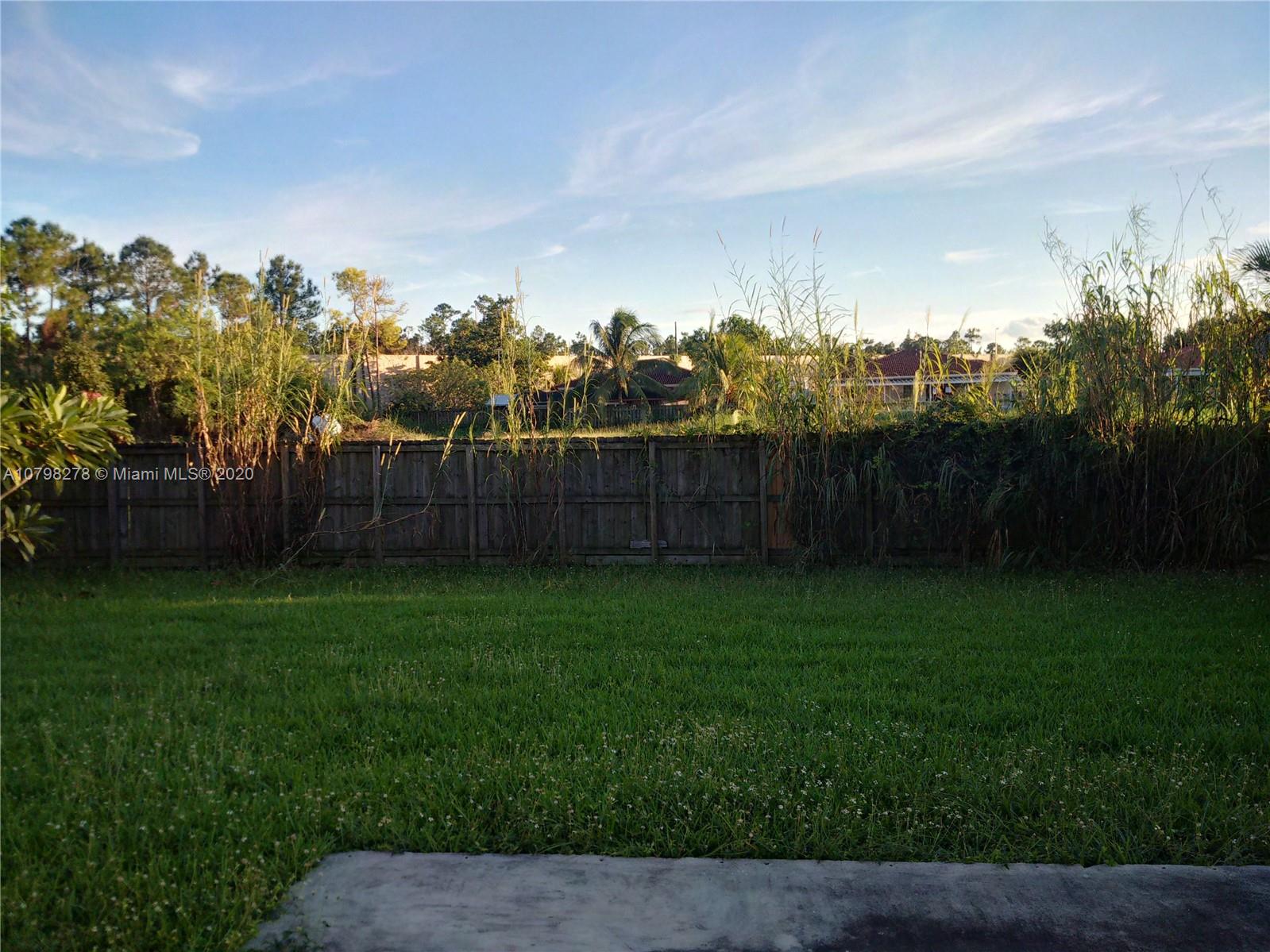 13060 Southwest 263rd Terrace Homestead, FL 33032 - Photo 25 of 28 a view of a yard