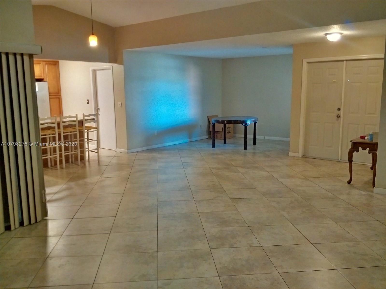 13060 Southwest 263rd Terrace Homestead, FL 33032 - Photo 6 of 28 a view of a hallway with chairs