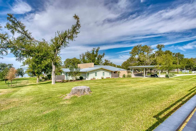 a outdoor space with patio the couches and pool table with chairs