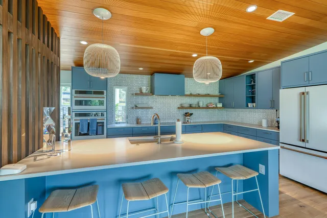 a living room with furniture a fireplace and a table