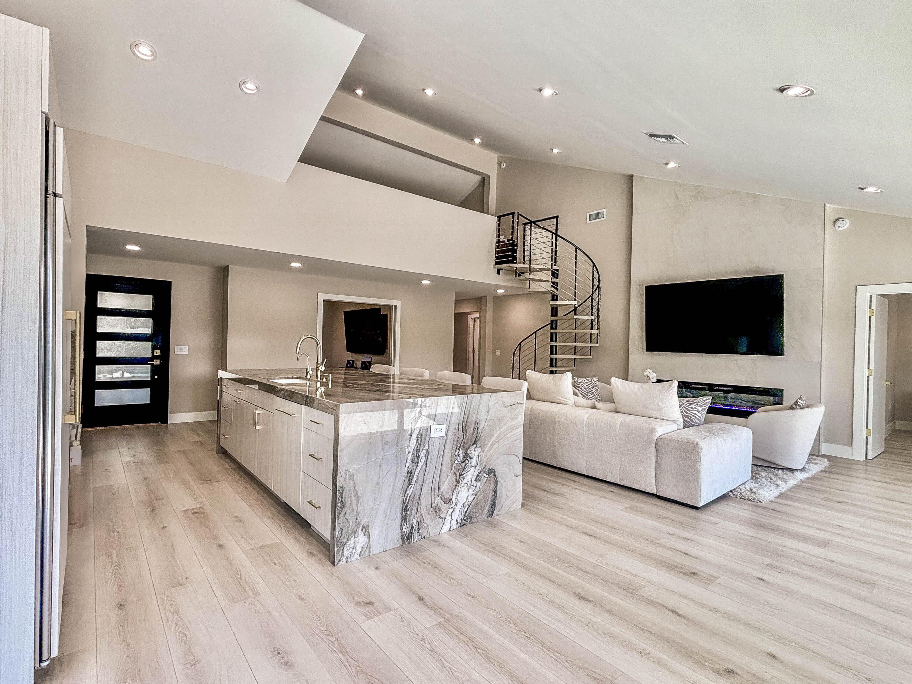 228 Ridge Road Jupiter, FL 33477 - Photo 2 of 13 a living room with furniture and a flat screen tv