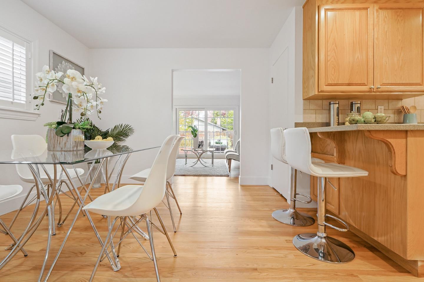 831 Flin Way Sunnyvale, CA 94087 - Photo 12 of 55 a dining room with furniture and wooden floor