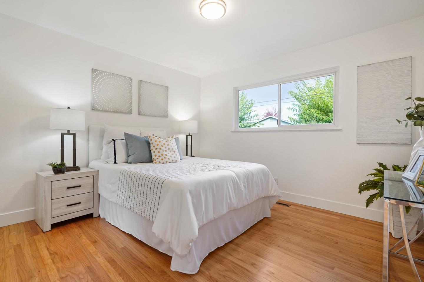 831 Flin Way Sunnyvale, CA 94087 - Photo 18 of 55 a bedroom with a bed and a window