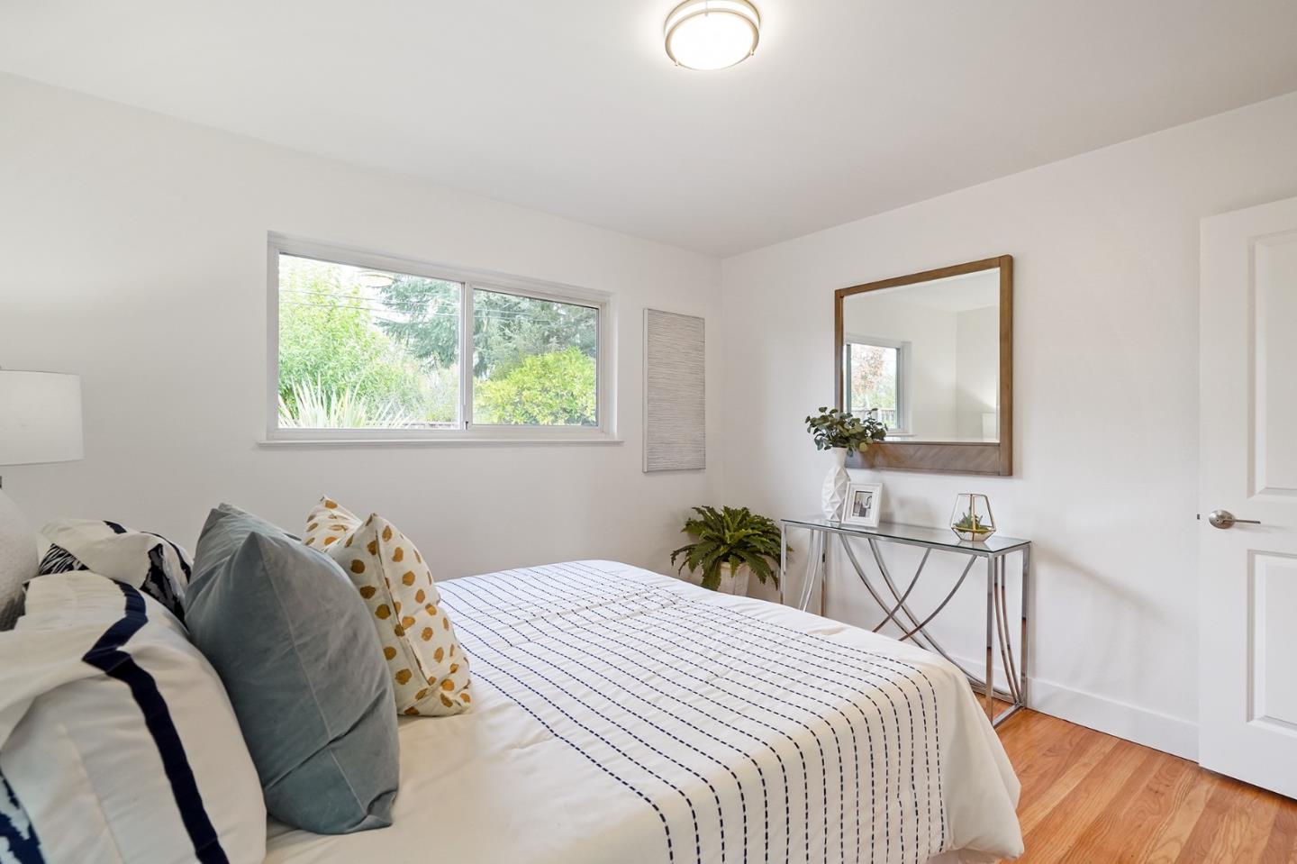 831 Flin Way Sunnyvale, CA 94087 - Photo 20 of 55 a bedroom with a bed and wooden floor