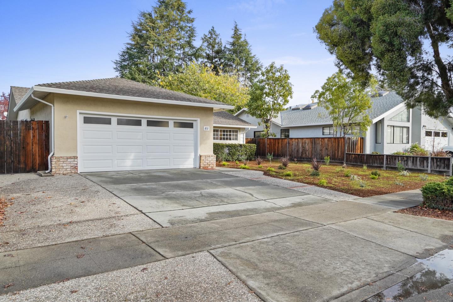 831 Flin Way Sunnyvale, CA 94087 - Photo 3 of 55 a view of a white house with a swimming pool and a yard