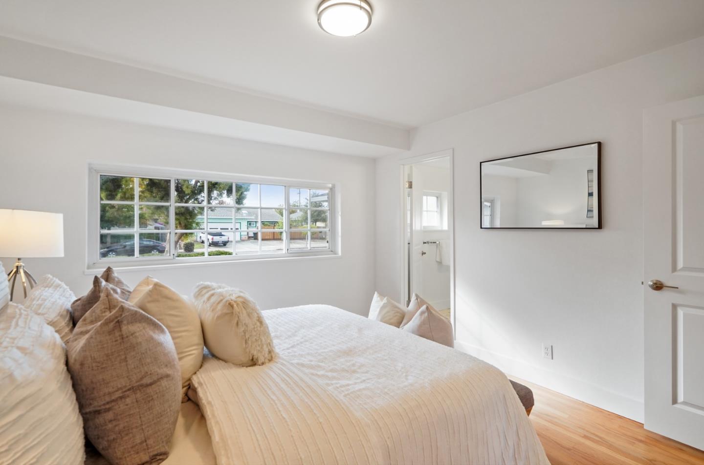 831 Flin Way Sunnyvale, CA 94087 - Photo 27 of 55 a bedroom with a large bed and a window