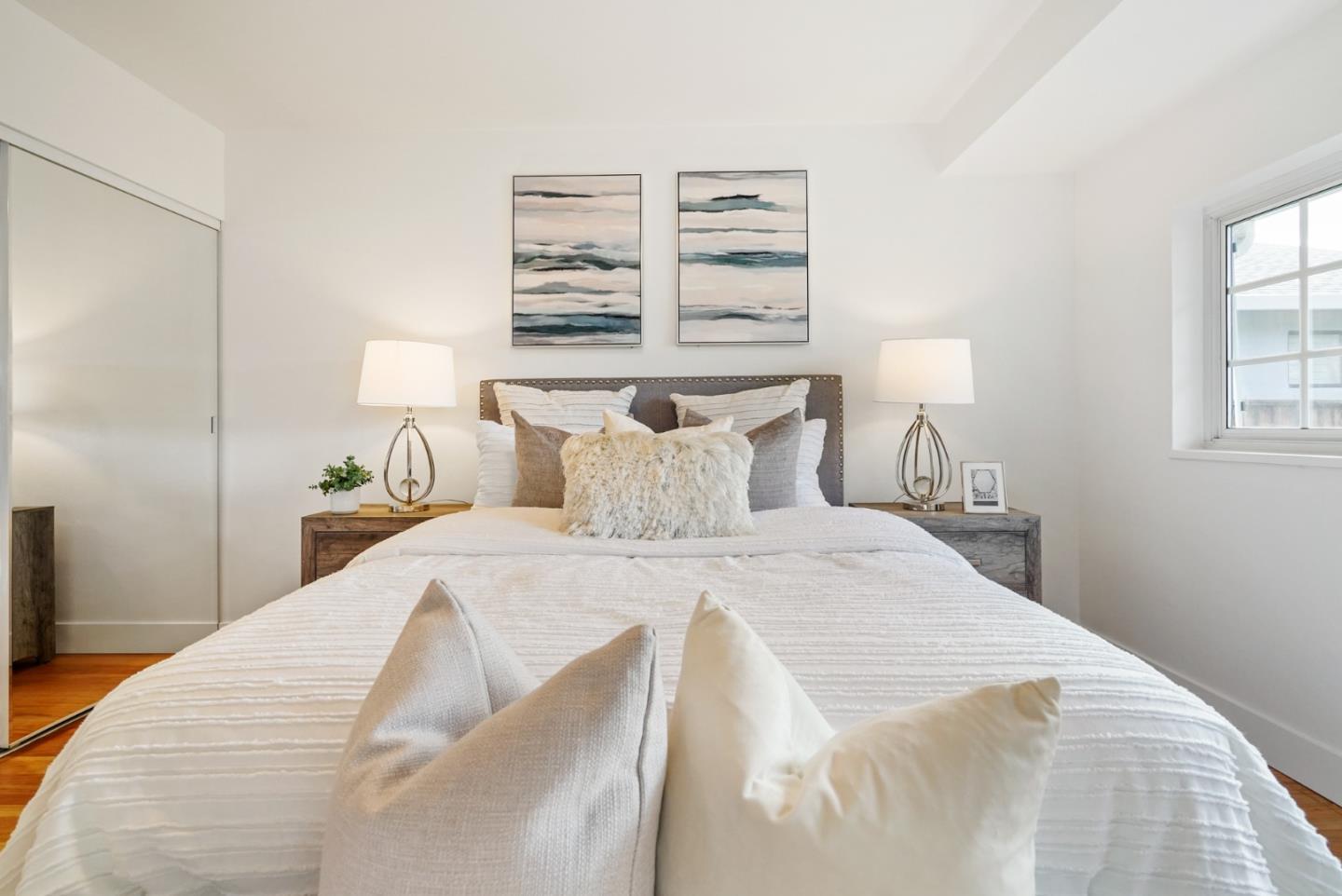 831 Flin Way Sunnyvale, CA 94087 - Photo 28 of 55 a bedroom with a bed and a night stand