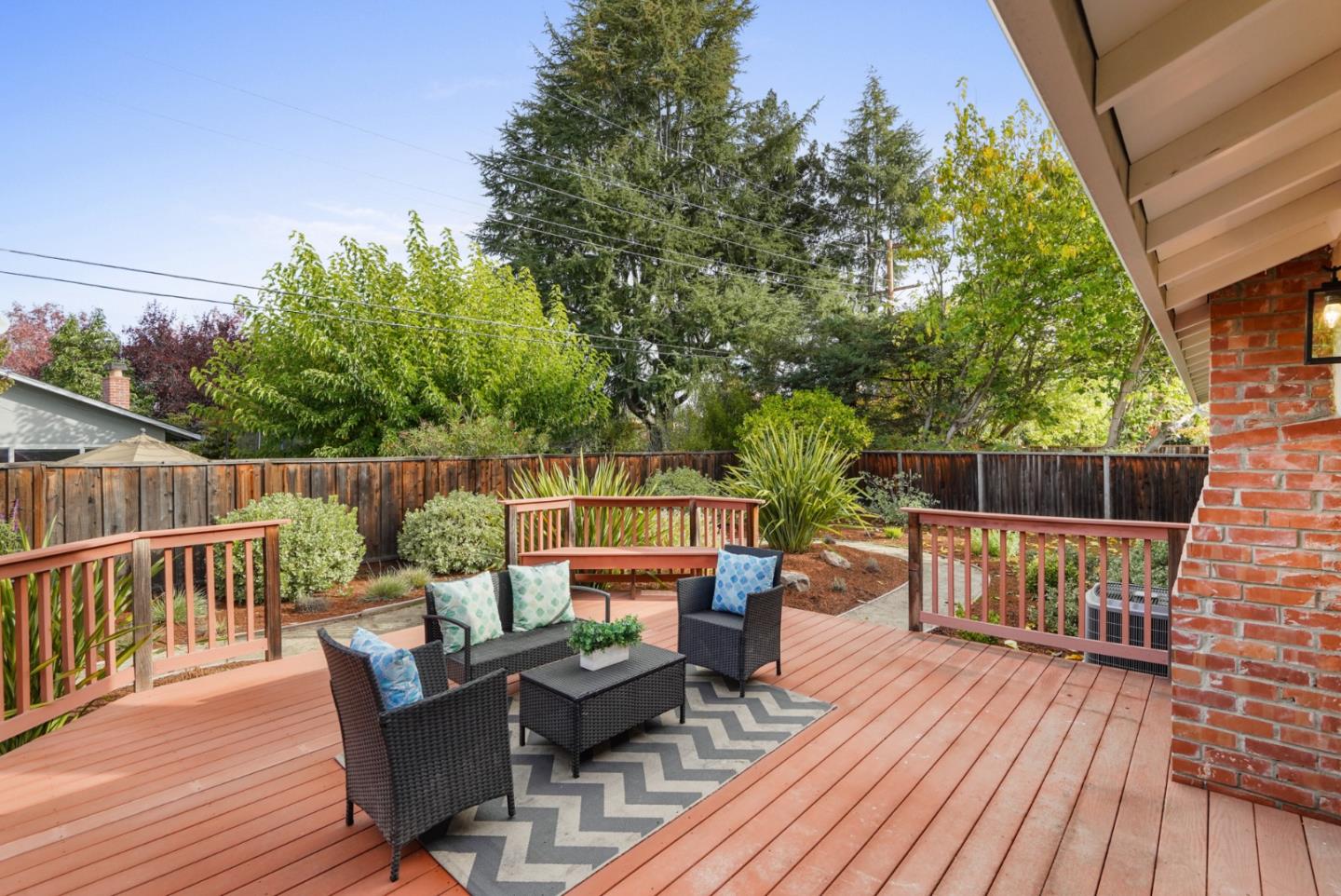 831 Flin Way Sunnyvale, CA 94087 - Photo 33 of 55 a balcony with wooden floor outdoor seating and yard in the back