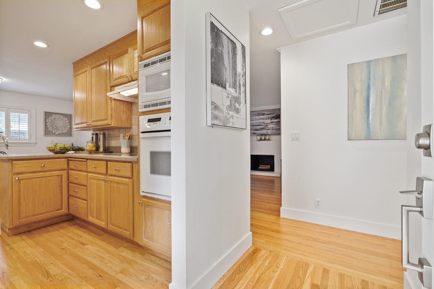 831 Flin Way Sunnyvale, CA 94087 - Photo 5 of 55 a kitchen with stainless steel appliances granite countertop a refrigerator and a stove top oven