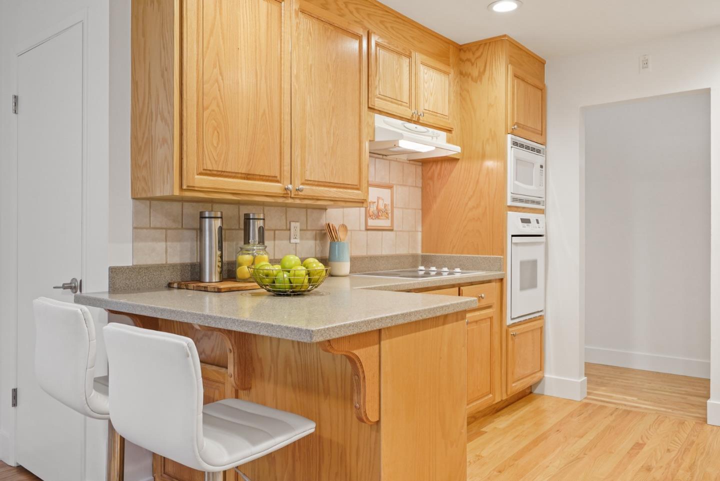 831 Flin Way Sunnyvale, CA 94087 - Photo 8 of 55 a kitchen with stainless steel appliances granite countertop a sink a stove and white cabinets