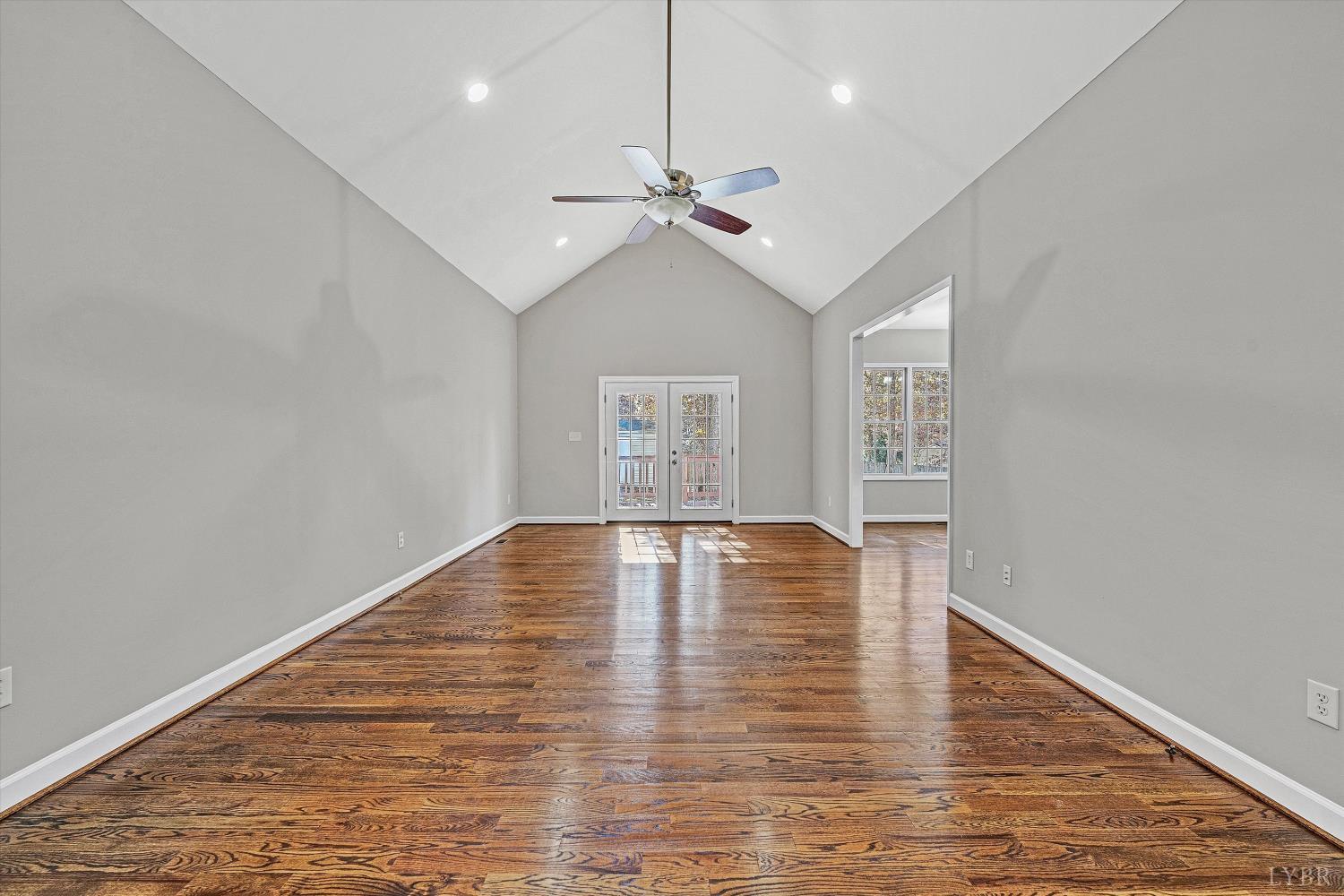 1182 Dan River Church Road South Boston, VA 24592 - Photo 14 of 43 a view of empty room with wooden floor and ceiling fan