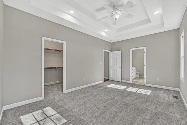 a bathroom with a double vanity sink mirror and toilet
