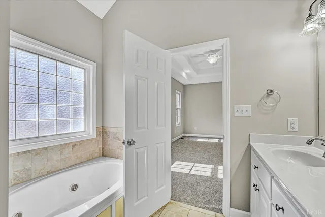 a bathroom with a tub and shower