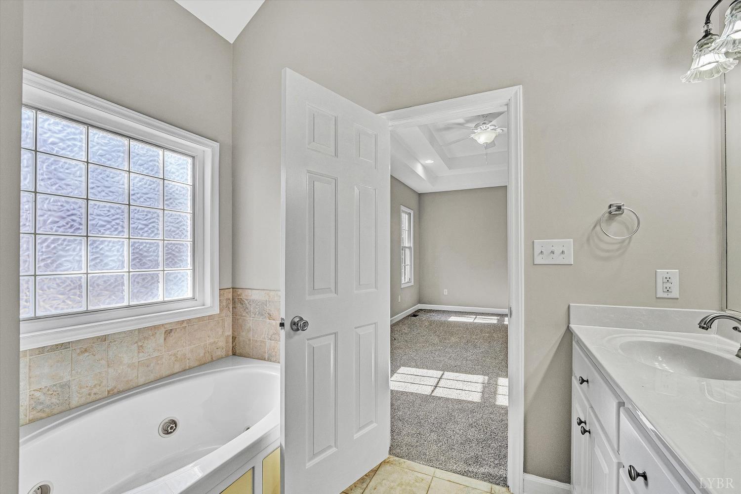1182 Dan River Church Road South Boston, VA 24592 - Photo 31 of 43 a bathroom with a tub sink and mirror