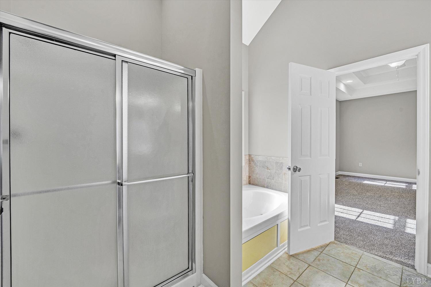 1182 Dan River Church Road South Boston, VA 24592 - Photo 32 of 43 a bathroom with a tub and shower