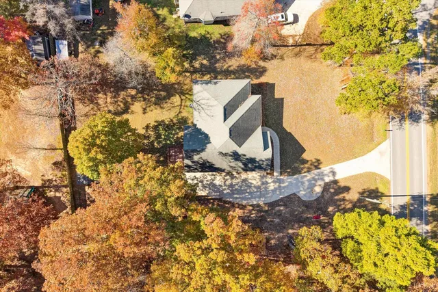 a view of a tree with a yard