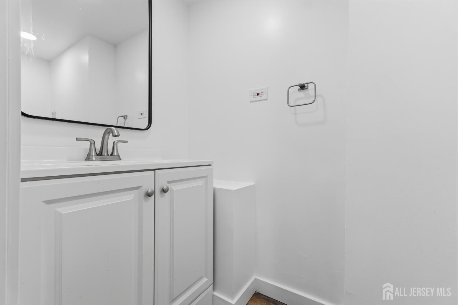 12 Daniel Road Spotswood, NJ 08884 - Photo 20 of 27 a bathroom with a sink and a mirror