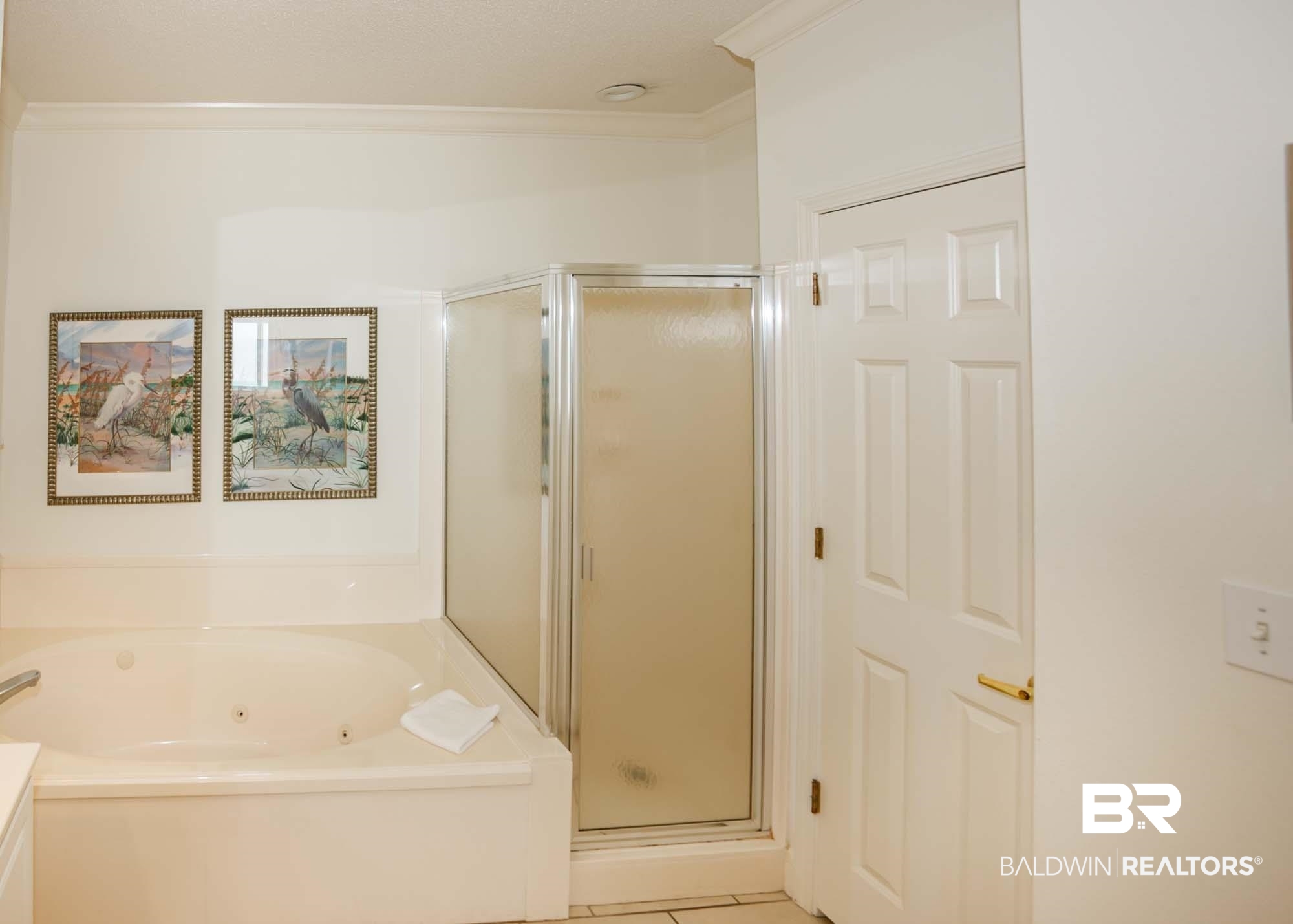 28910 Perdido Beach Boulevard, Unit 4B Orange Beach, AL 36561 - Photo 24 of 48 Bathroom featuring a stall shower, a tub with jets, and ornamental molding