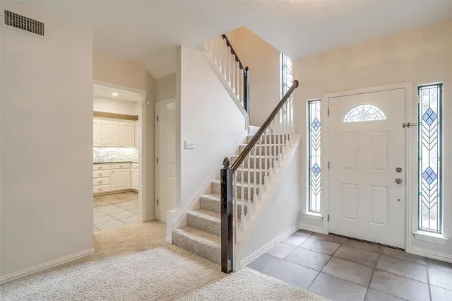 a view of an entryway with wooden floor