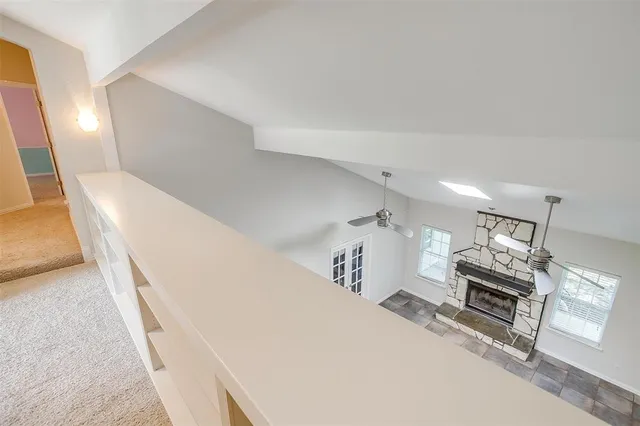 a view of a deck with wooden floor and fence