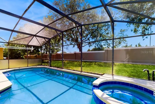 a view of a swimming pool with a porch