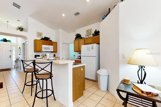a view of a kitchen and dining room