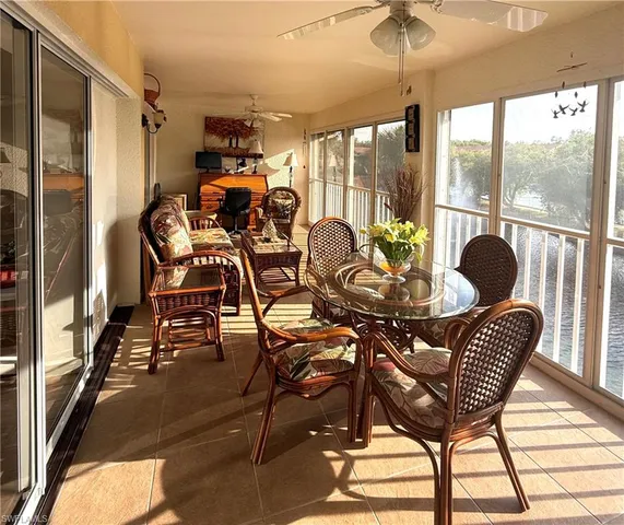a view of a dining room with furniture window and outside view