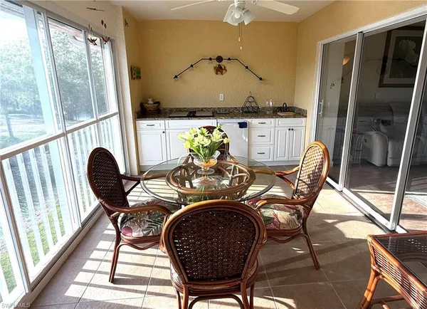 a view of a dining room with furniture window and outside view
