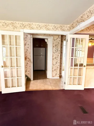 a kitchen with granite countertop a sink appliances and cabinets