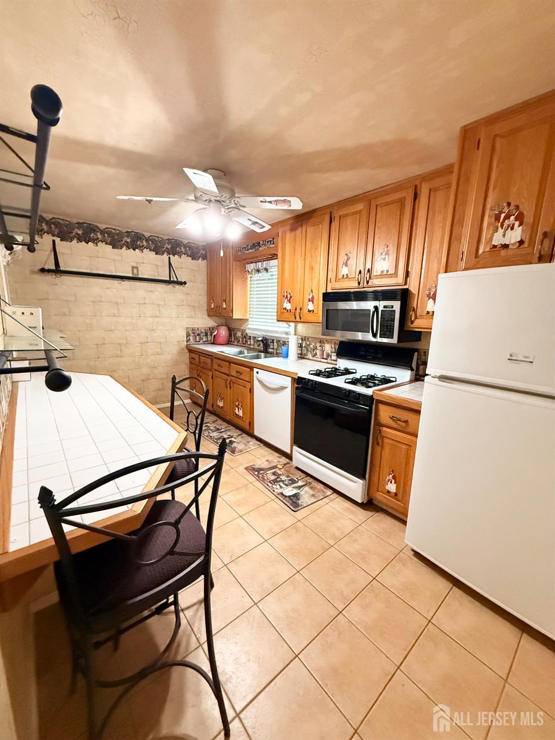 16 Marsad Drive Old Bridge, NJ 08857 - Photo 12 of 18 a kitchen with granite countertop a sink appliances and cabinets