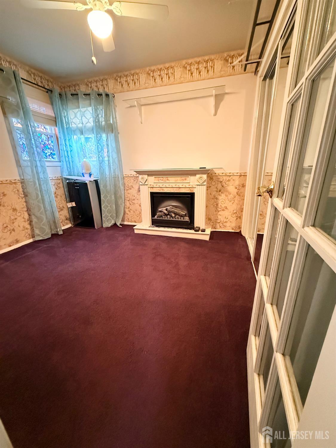 16 Marsad Drive Old Bridge, NJ 08857 - Photo 13 of 18 a view of an empty room with a fireplace and a window