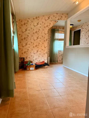 a white toilet sitting next to a shower curtain