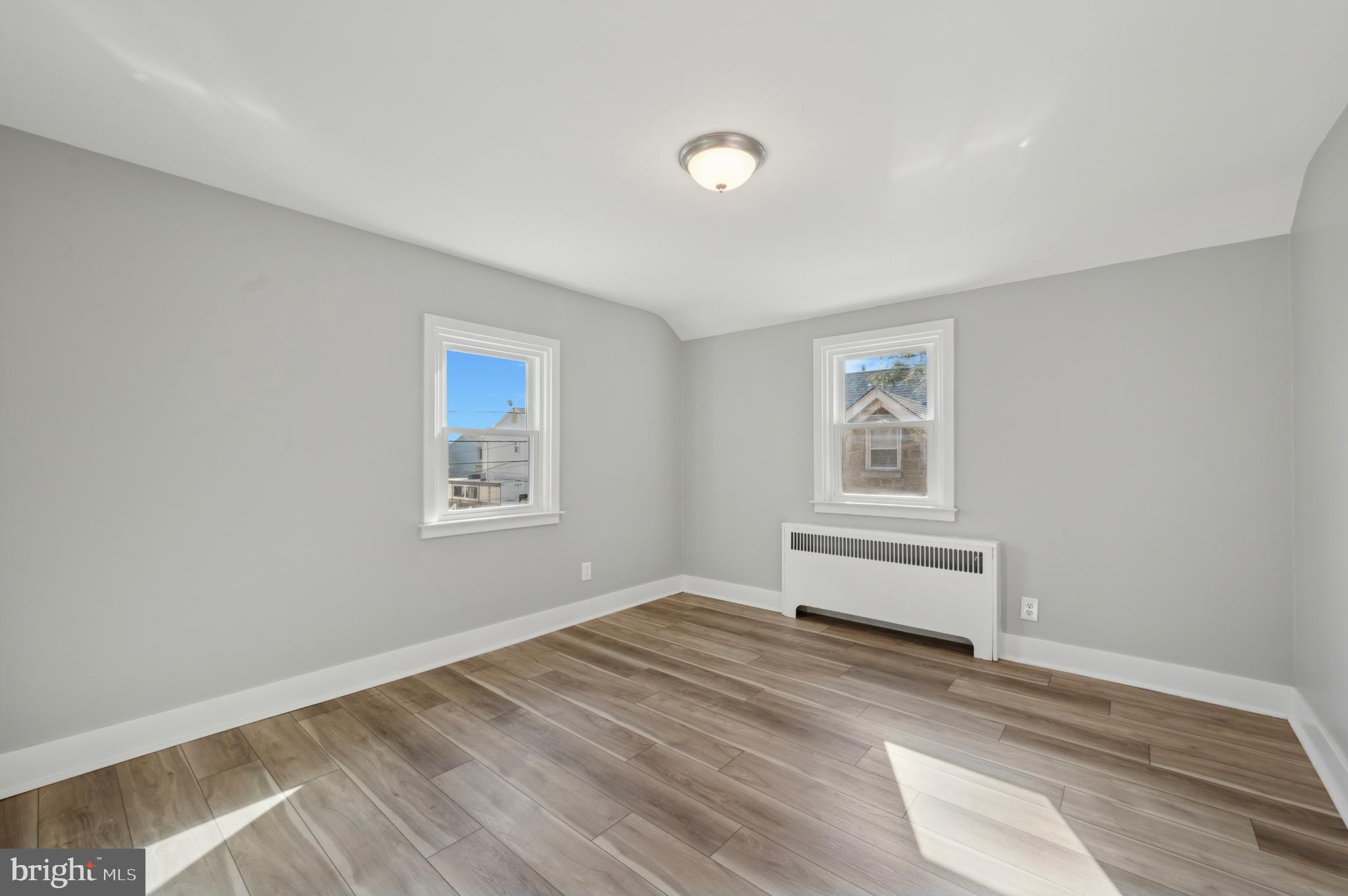 1230 MacDade Boulevard Woodlyn, PA 19094 - Photo 12 of 16 a view of empty room with window and wooden floor