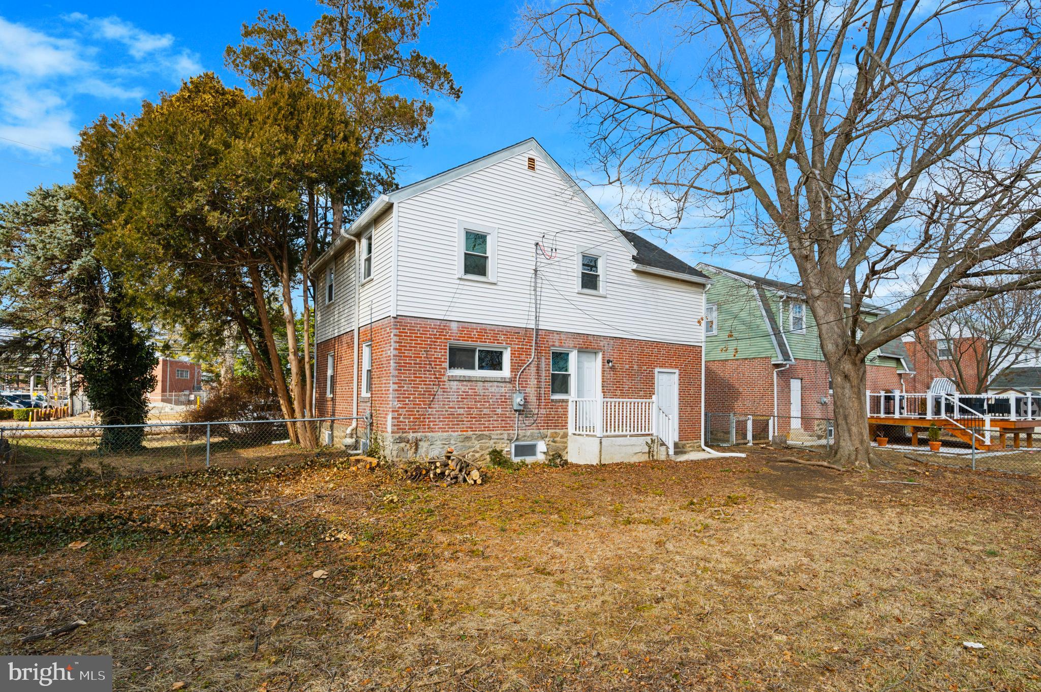 1230 MacDade Boulevard Woodlyn, PA 19094 - Photo 15 of 16 a front view of house with yard covered with trees