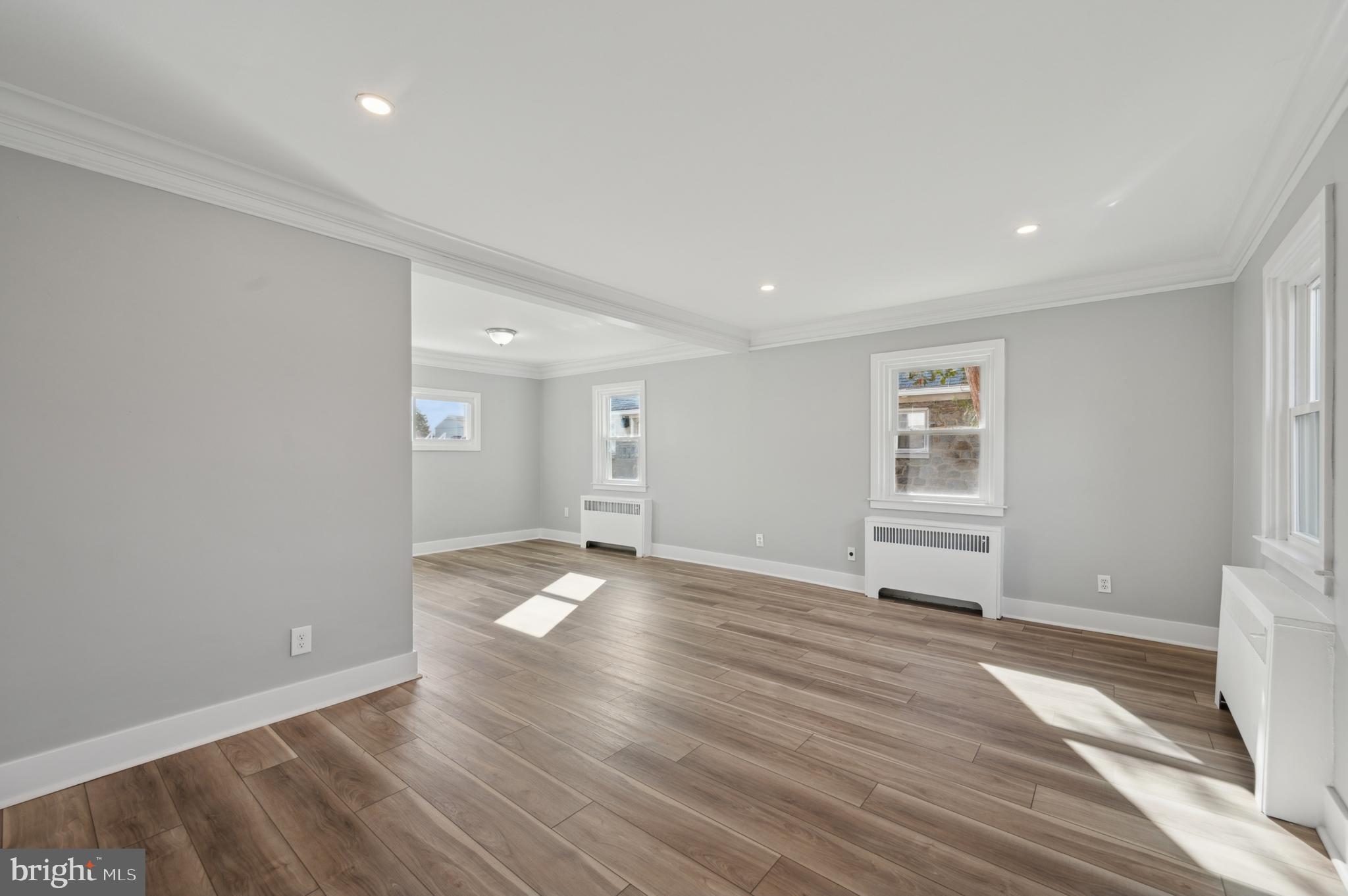 1230 MacDade Boulevard Woodlyn, PA 19094 - Photo 2 of 16 a view of a livingroom with wooden floor and window