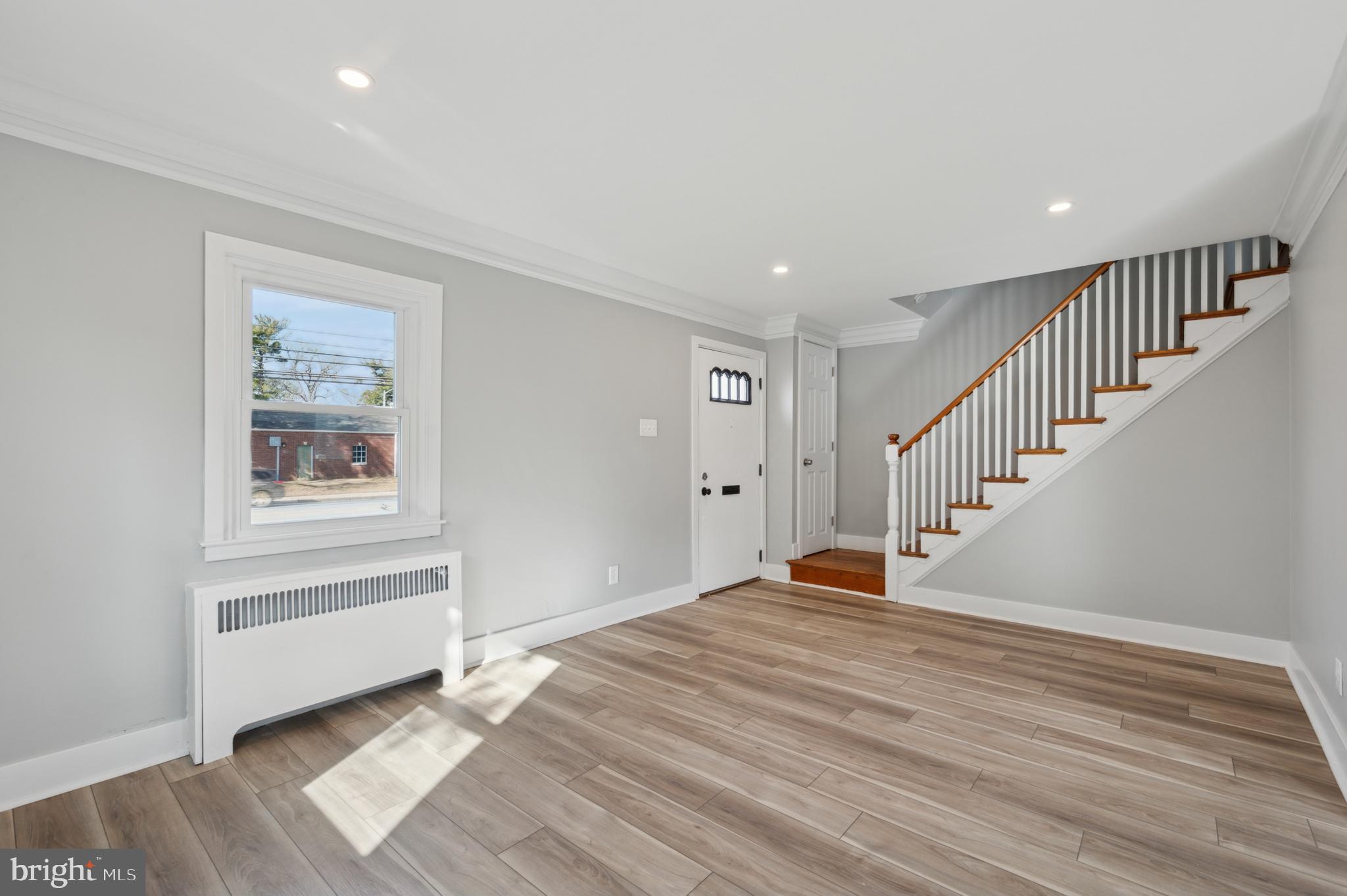 1230 MacDade Boulevard Woodlyn, PA 19094 - Photo 3 of 16 a view of a livingroom with wooden floor and stairs