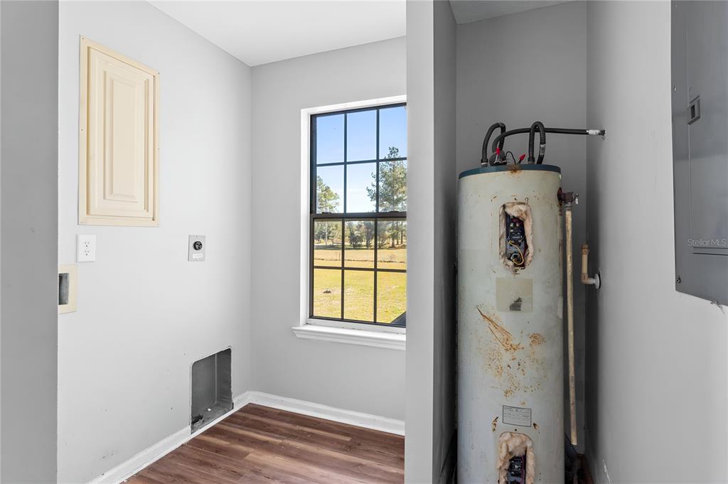 17380 Northwest Green Acres Road Bristol, FL 32321 - Photo 24 of 35 a view of an empty room with window and closet area