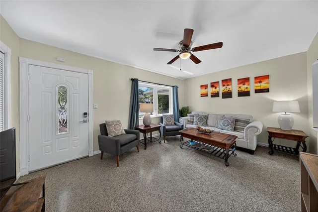 a living room with furniture and a window