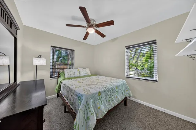 a bed room with a bed and a lamp