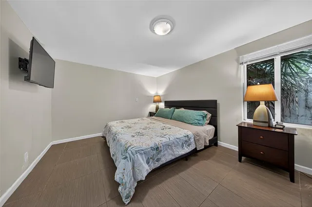 a bedroom with a bed and window