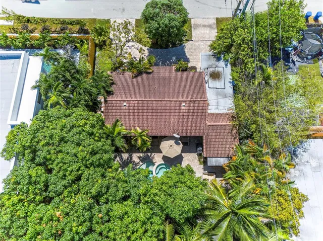 a aerial view of a house with garden and plants