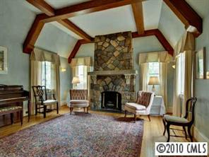 2143 Norton Road Charlotte, NC 28207 - Photo 2 of 8 a living room with furniture and a fireplace