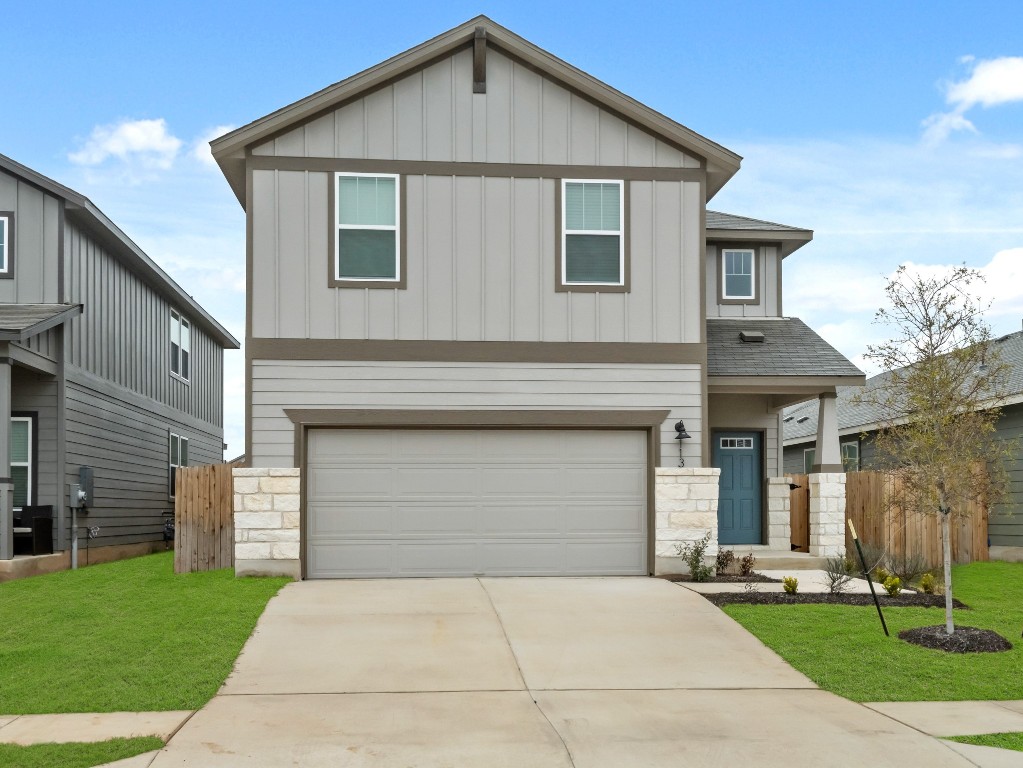 113 Greenway Drive Georgetown, TX 78628 - Photo 1 of 1 a front view of a house with a yard and garage