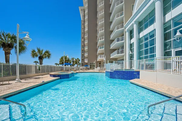 a view of a swimming pool with a lounge chairs
