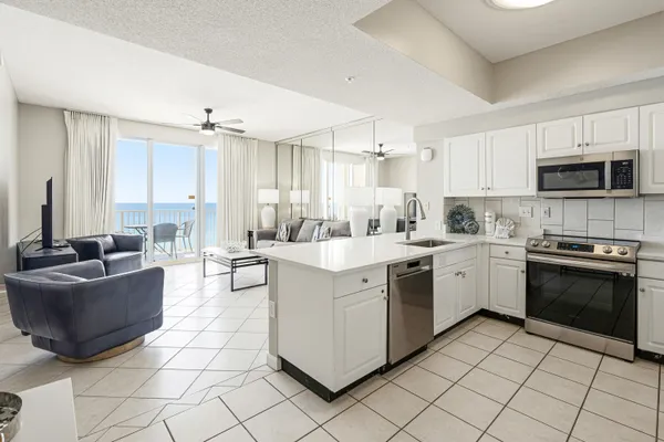 a kitchen with cabinets and stainless steel appliances
