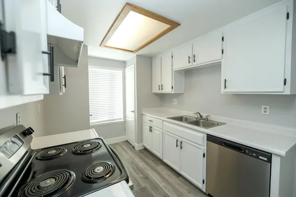 a kitchen with a stove and a sink