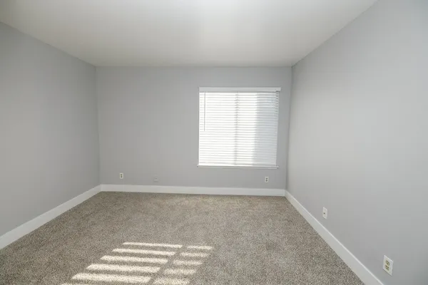 a view of an empty room and window
