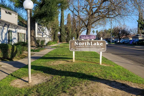 a swimming pool with outdoor seating and yard