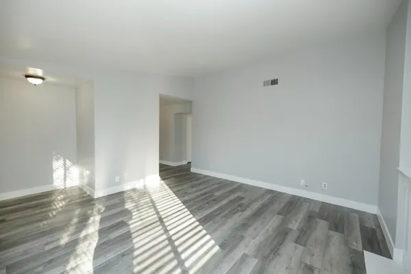 a view of an empty room and window